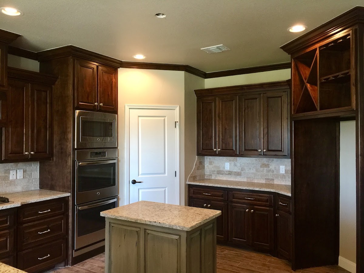 Kitchen with dark stained cabinets and freshly painted walls