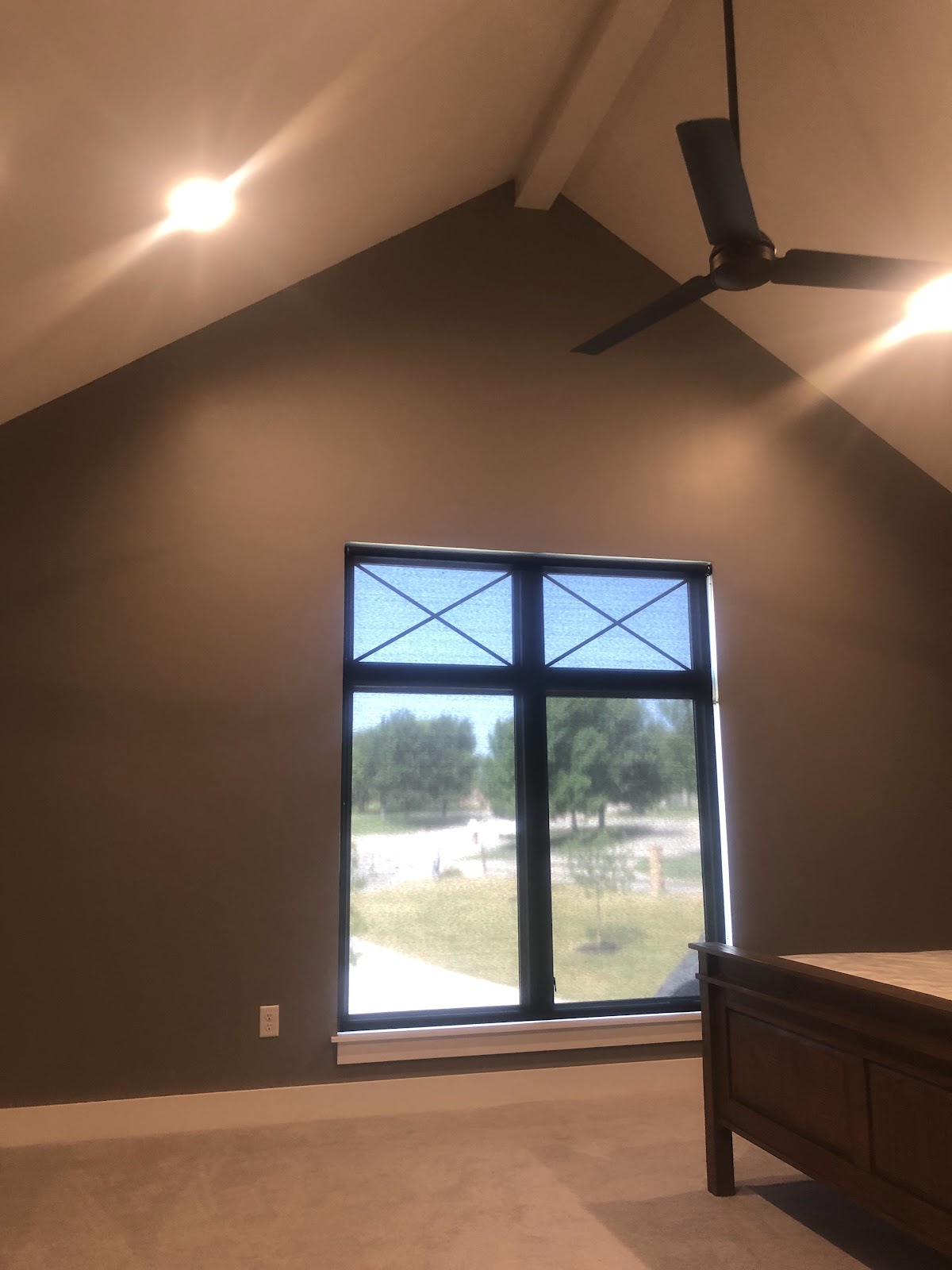 Bedroom with vaulted ceiling and freshly painted walls and trim